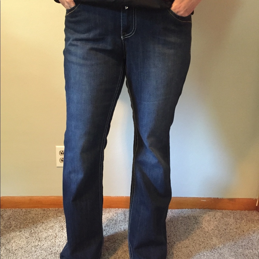 Boot leg jeans with button close back pockets